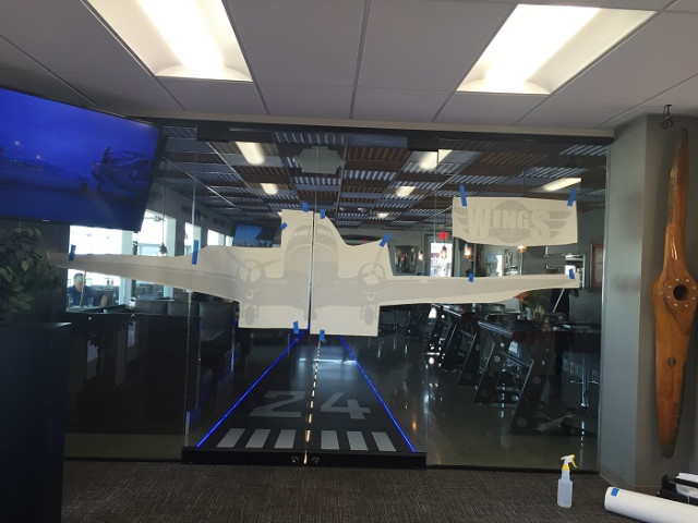 Installing window graphics for restaurants in Fullerton CA