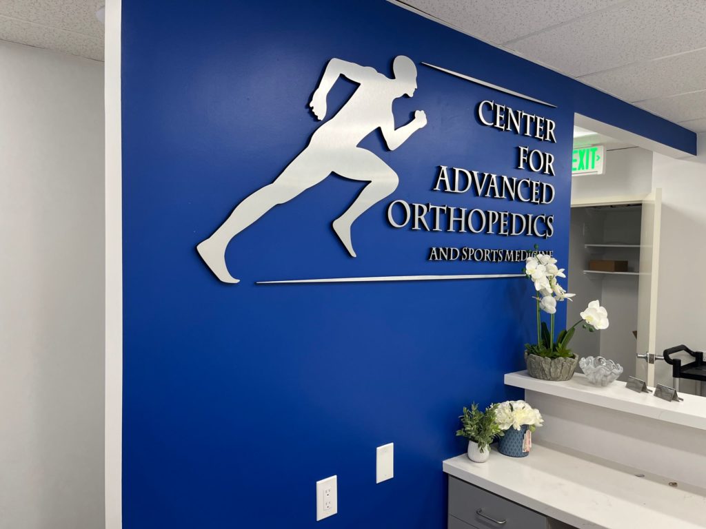 brushed metal lobby logo signs in lakewood, ca