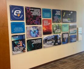 Acrylic panel signs mounted with brushed aluminum wall standoffs in irvine, ca