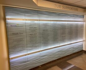 frosted acrylic wall panel signs mounted with brushed aluminum standoffs in orange county, ca