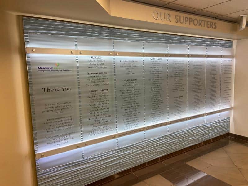 frosted acrylic wall panel signs mounted with brushed aluminum standoffs in orange county, ca